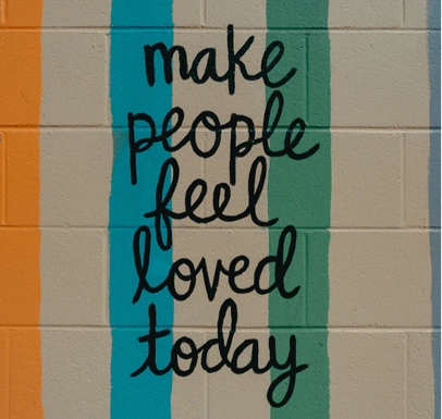 wall writing says make people feel loved today