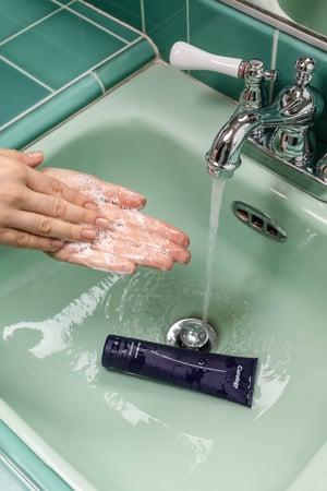 washing hands in sink