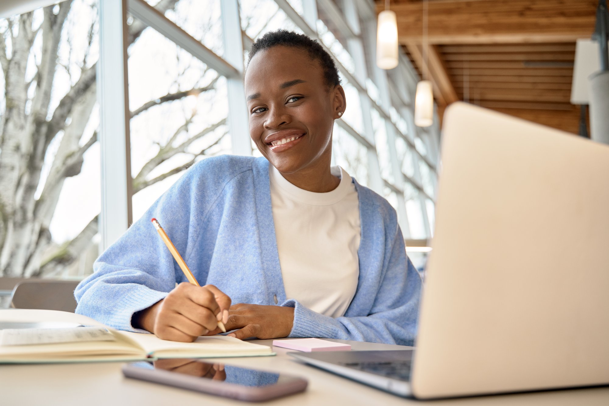 happy-african-girl-student-using-laptop-learning-o-2025-02-11-16-20-21-utc