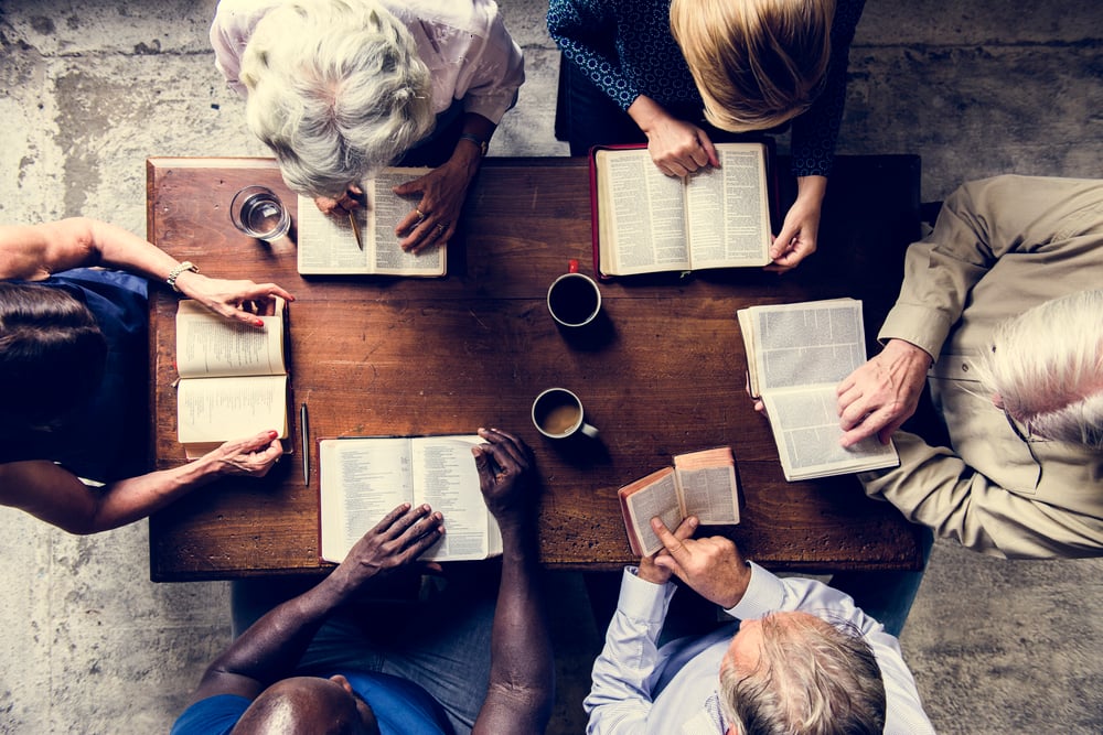 studying-bibles-together-around-wooden-table-2026-01-07-23-30-41-utc studying-bibles-together-around-wooden-table-2026-01-07-23-30-41-utc